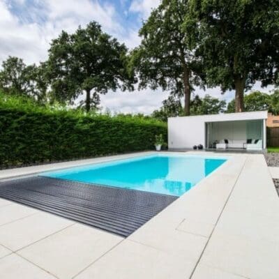 Rectangular in-ground swimming pool with pool house