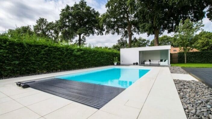 Rectangular in-ground swimming pool with pool house
