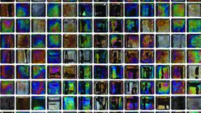 Mosaic of small iridescent square glass tiles forms a grid, colors shimmer blue, green, purple and brown while a darker cross shaped pattern appears at the center with white grout