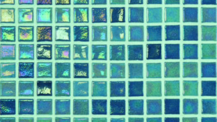 Small square glass tiles form a regular grid, shimmering with iridescent teal, turquoise and blue reflections across a flat tiled panel.