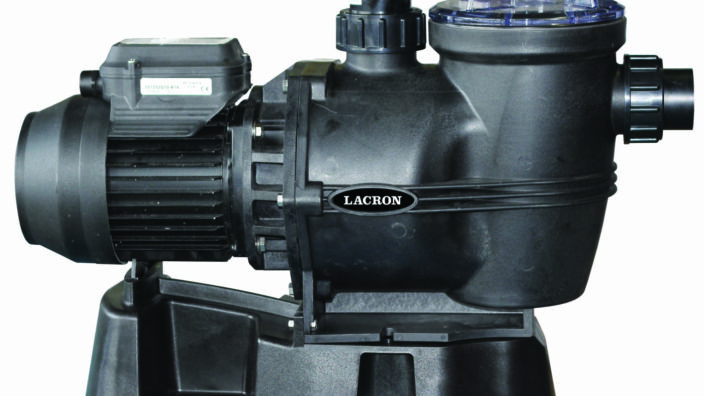 Black pool pump labeled LACRON pumps water, electric motor on the left connected to a strainer housing with clear lid and pipe fittings, all mounted on a molded plastic base.