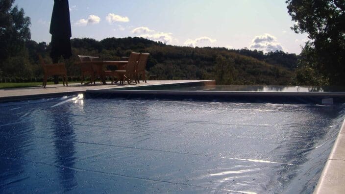 Swimming pool with blue cover