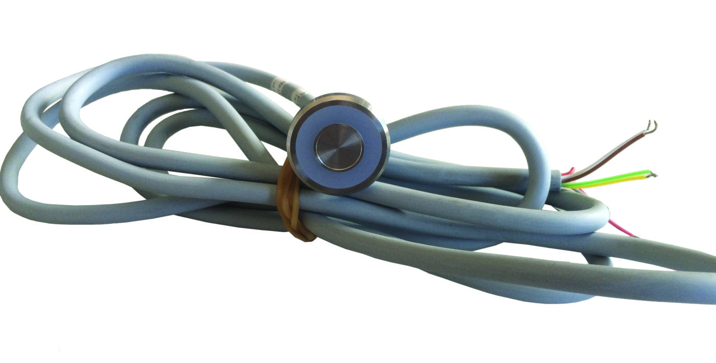 Thick gray multi-conductor cable coiled and secured with a rubber band, with a round metal sensor near the wrap and colored exposed wires at one end on a white background.
