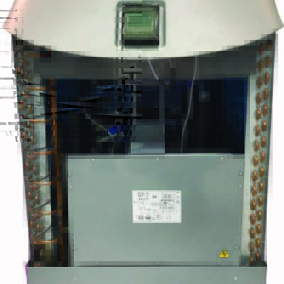 Outdoor HVAC condenser unit with front panel removed, exposing copper coils, compressor and wiring inside, gray metal housing on white background, small technical label on panel illegible.