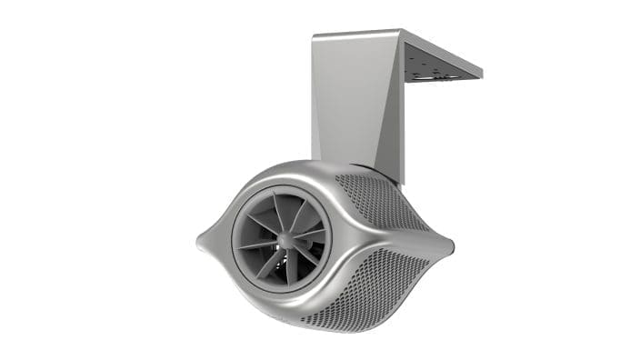 Silver ceiling-mounted turbine fan rotates inside a streamlined perforated housing, attached to a rectangular mounting bracket above, suspended against an otherwise plain white background.